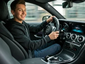 Boy Holding the Mercedes Steering Wheel