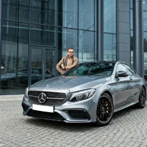 Person standing with mercedes