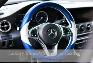 Close-up of Mercedes Benz C300 steering wheel wrapped in a premium blue and white leather cover showing the luxury car interior.